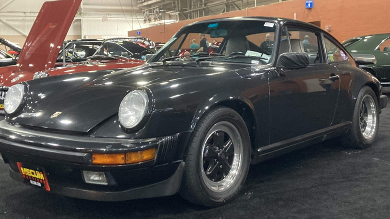 1989 Porsche 911 Turbo at indoor show, front-left 3/4 view