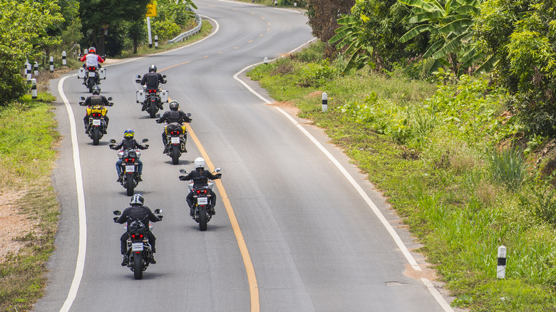 Motorcycles riding in a staggered group