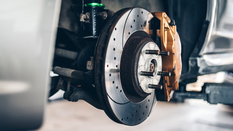 A car's brakes assembly with the wheel removed.
