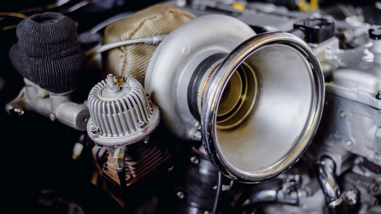 A close-up of a large turbocharger in a diesel engine