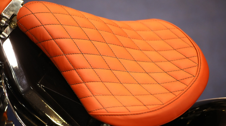 An orange motorcycle seat