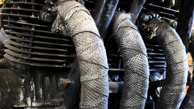 Heat wrapped exhaust of a four-cylinder cafe racer engine