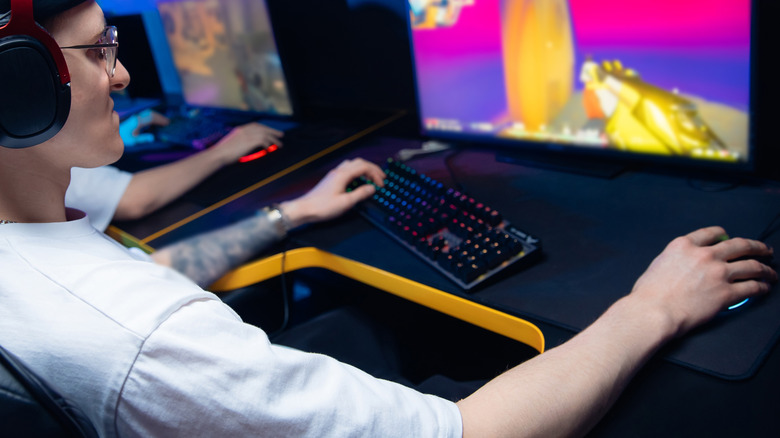 An esports player competes in a first person shooter game