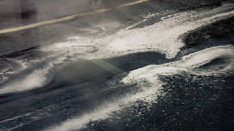 Dense foam formation on the side of the road