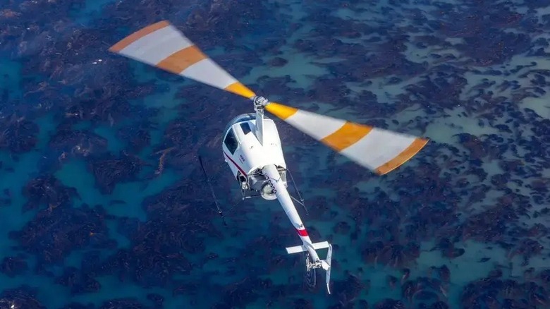 A Robinson helicopter with the improved symmetrical horizontal stabilizer.