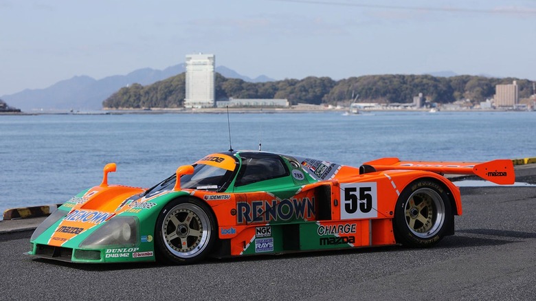 1991 Mazda 787B parked next to lake, front-left three-quarter view