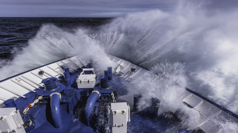 Bow of ship hitting a big wave and sending up into the boat in the Drake passage.
