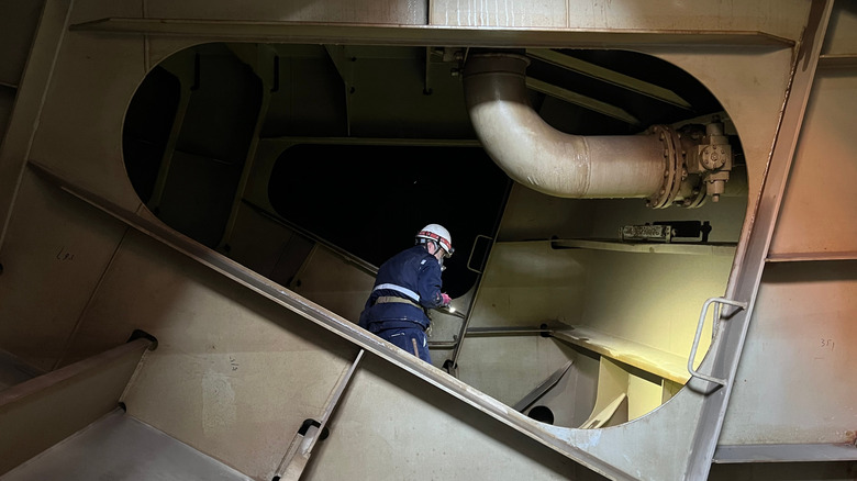 Man inspecting open ballast tank
