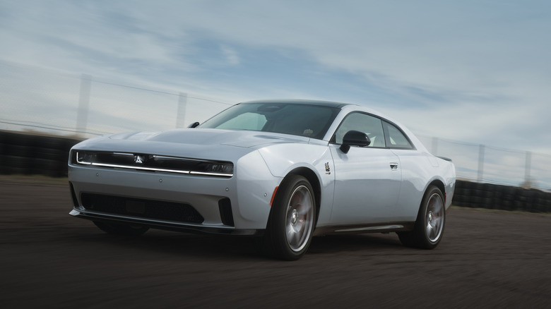 Silver Dodge Charger Daytona driving on a race track
