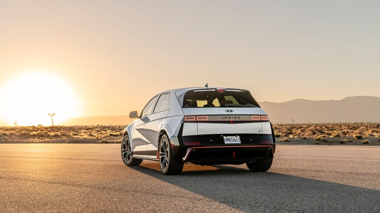 Silver Hyundai Ioniq 5 N parked in the desert at sunset