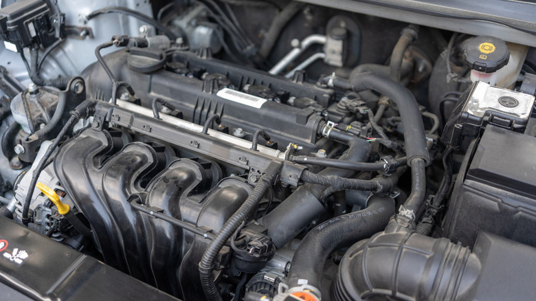 A close-up of an exposed car engine bay