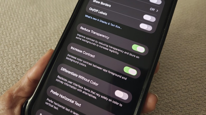 The display and text size page of an iphone's accessibility settings can be seen onscreen with reduce transparence and increase contrast enabled