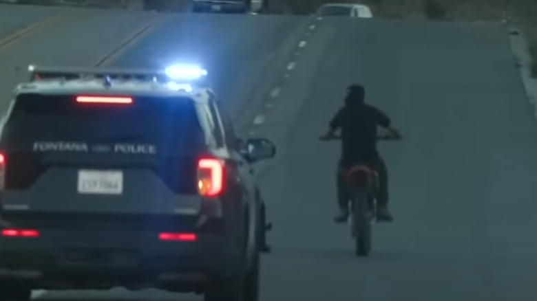 Police initiating a traffic stop on motorcyclists