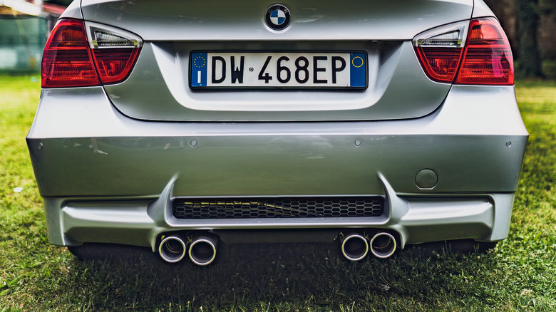 Silver BMW featuring a quad exhaust system