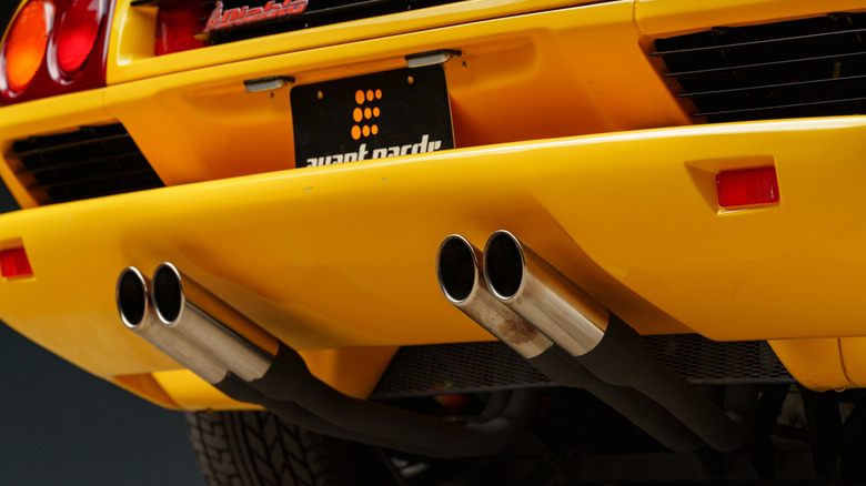 Yellow Lamborghini with four exhaust pipes