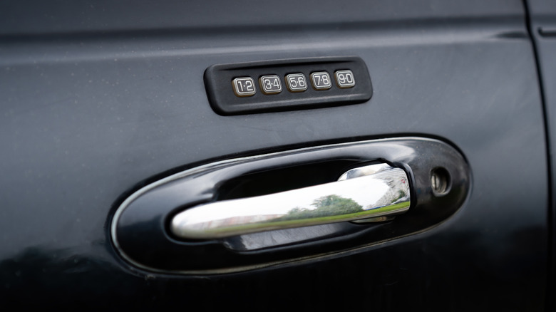 A Ford Securicode keypad on the door of a black Lincoln