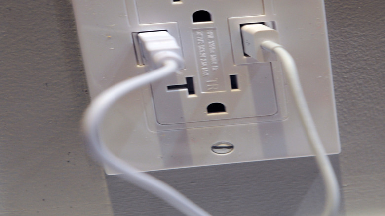 Wall outlet with USB ports and outlet with T-shaped hole