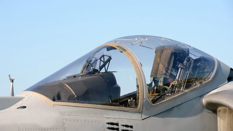 Modern military jet canopy and cockpit showing zigzag lines across the top of the canopy