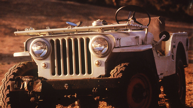 1946 Jeep Willys Universal, white, front-view with windshield folded down