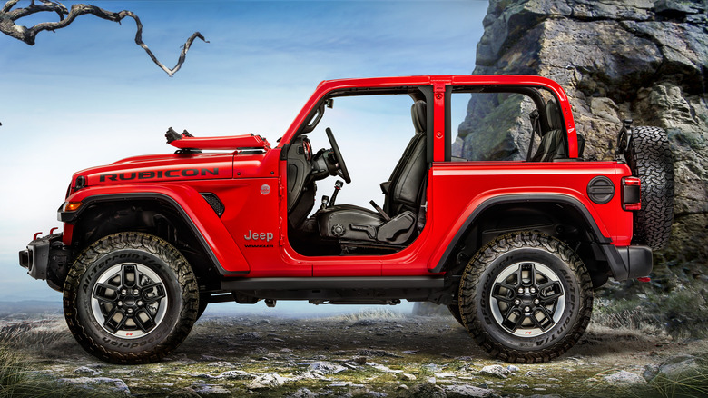 2018 Jeep Wrangler with doors and roof removed, windshield folded, left-side view