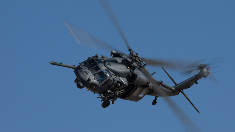 UH-60 Black Hawk helicopter in flight against a blue sky