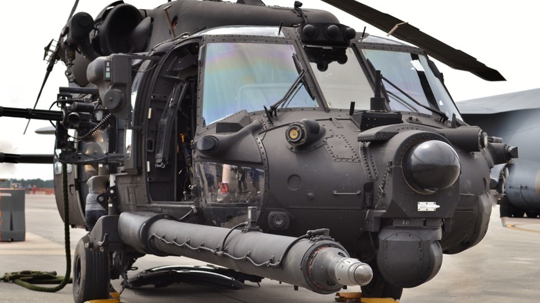 A grounded MH-60 Black Hawk on a cloudy day