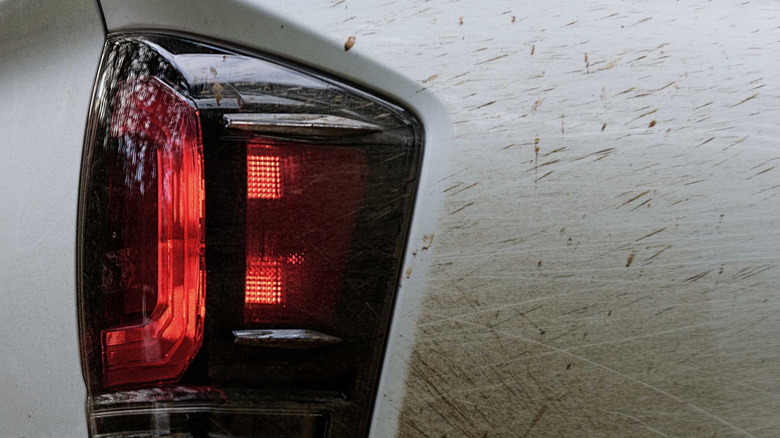 Close up view of taillight on white 2020 Toyota Tacoma.
