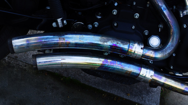 Detail of double exhaust in shining blue