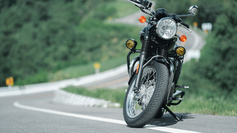 Front of a motorcycle parked on a road