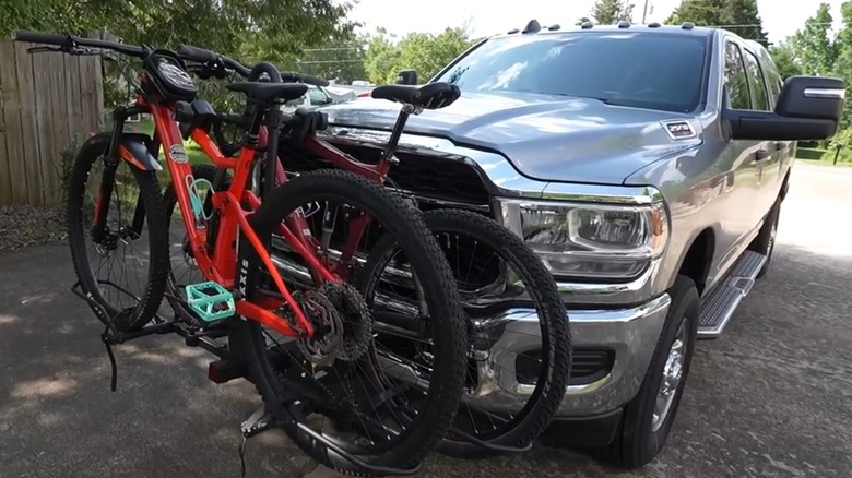 A truck with a bike rack attached to the front.