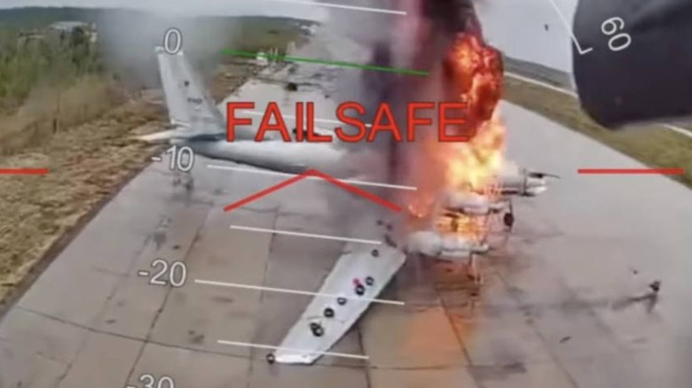 A photo of a FPV-drone-struck military plane Tu-95 at Russia's Olenya airbase during an attack