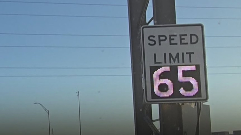 An electronic variable speed limit sign in Texas displaying a limit of 65 mph