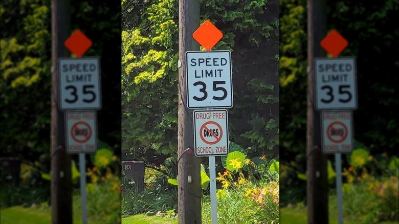 speed limit sign with orange diamond