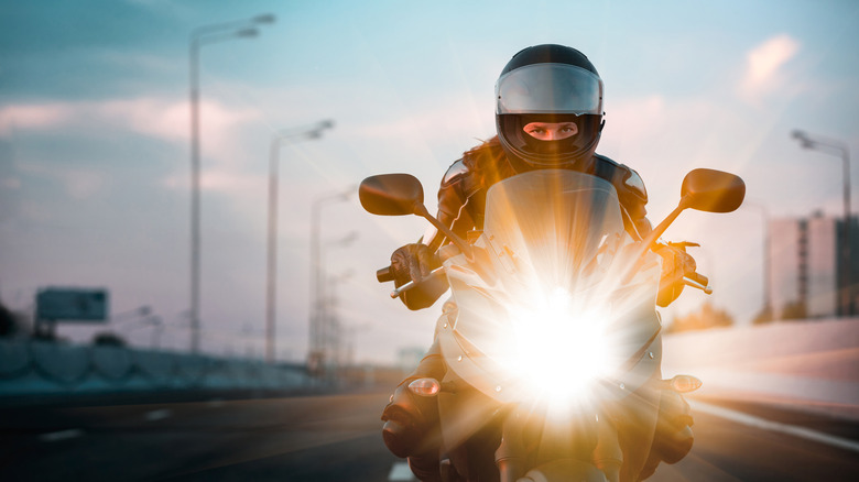Motorcyclist riding with helmet