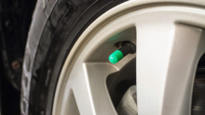 Car tire's valve stem with a green cap