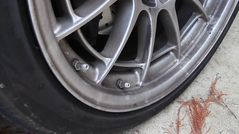 Car tire with two valve stems