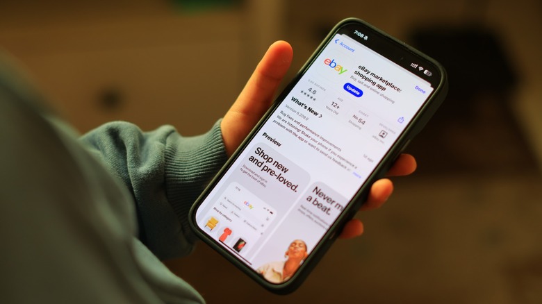 Person looking at eBay app on a smartphone