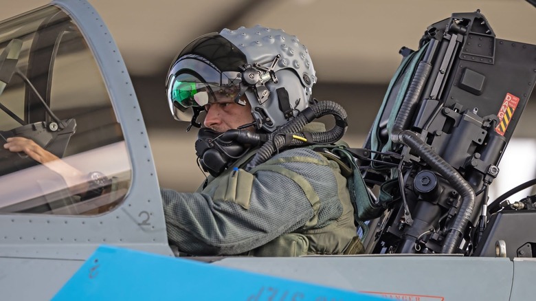 Eurofighter Typhoon pilot in cockpit with the Striker HMD helmet