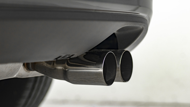 Close-up of modern muscle car's exhaust with dual exhaust tips