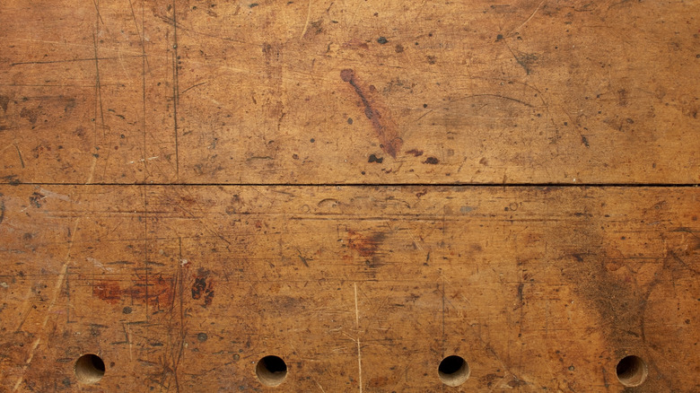 Woodworking bench with drilled dog holes