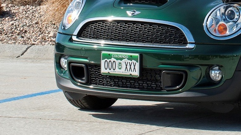 Green car with CSU license plate