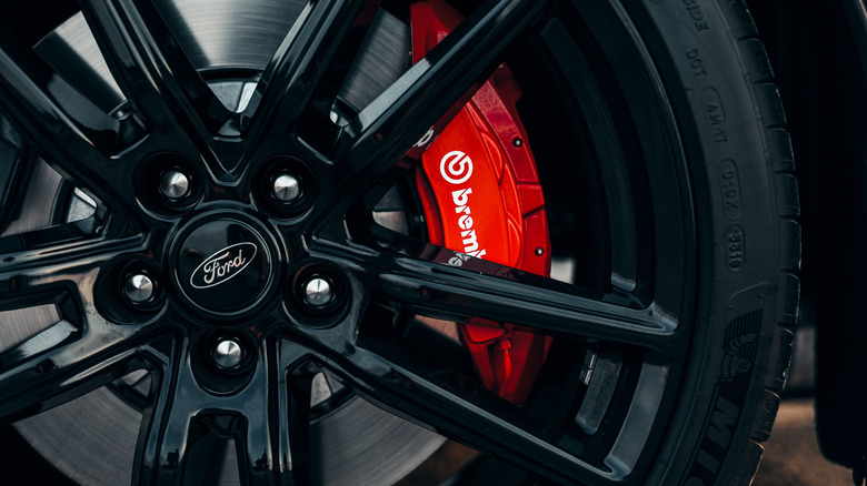 Black Mustang Shelby Cobra showing the black wheel with red Brembo brake calipers