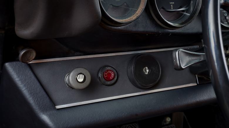 Porsche 911 interior showing key switch ignition on the left side
