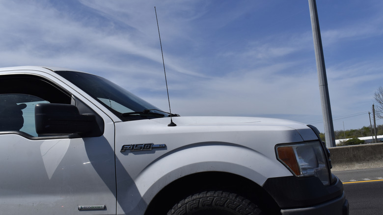 A white Ford F-150 pick-up truck