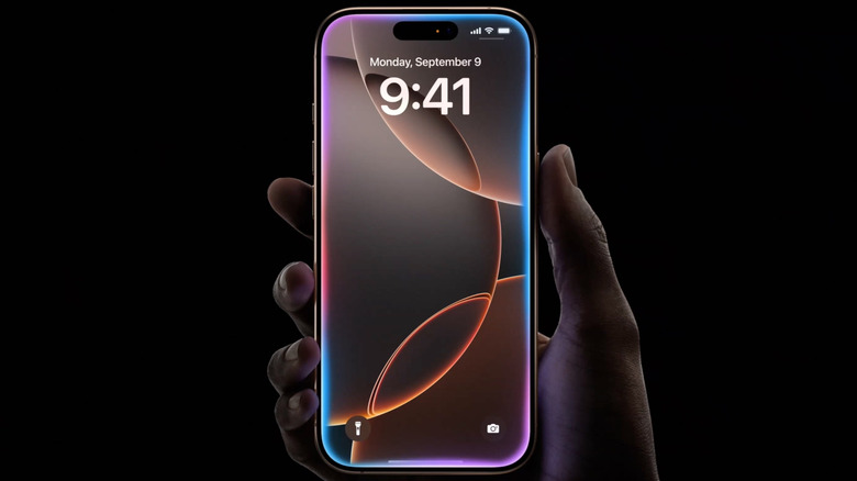 Person holding an iPhone 16