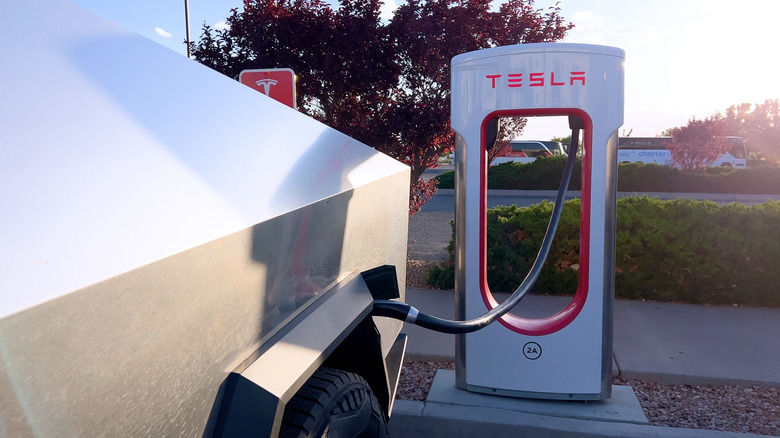 A Tesla Cybertruck being charged using a Tesla Supercharger