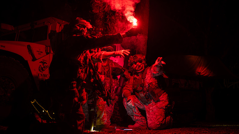 A group of US Marines planning a night operation in red light