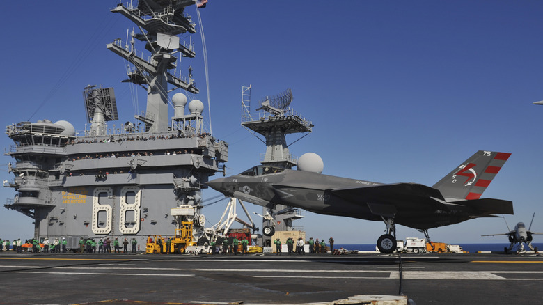 An F-35C landing on an aircraft carrier