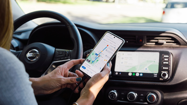 A person using Android Auto in a car