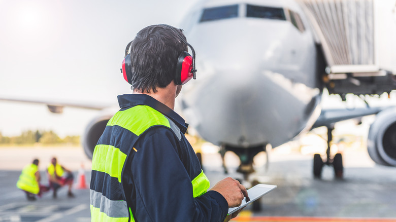 Worker inspects aircraft